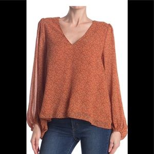 Astr the label top M